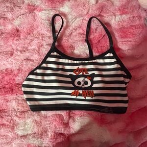 Black and white stripped top with red accents